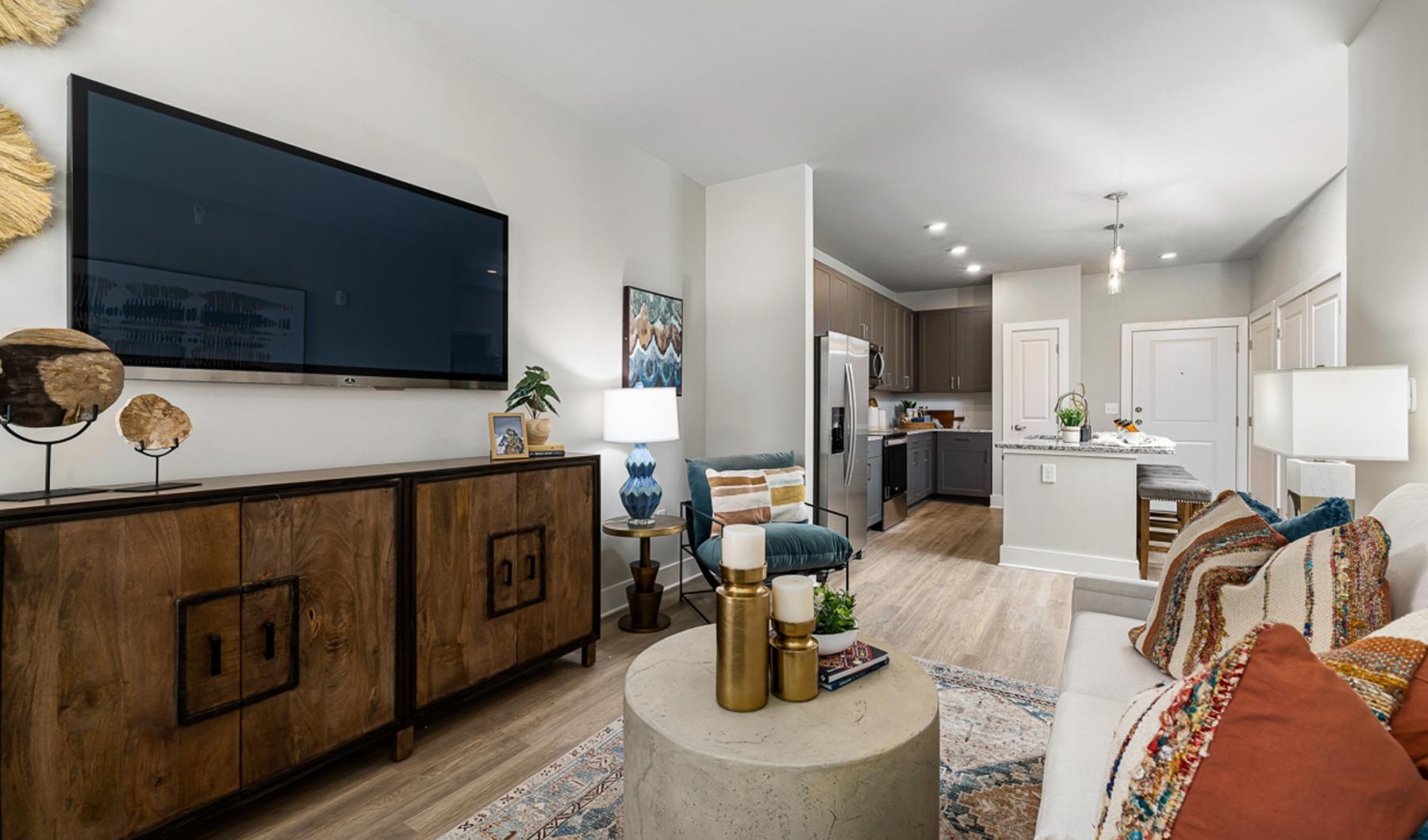 a living room with a tv and couches