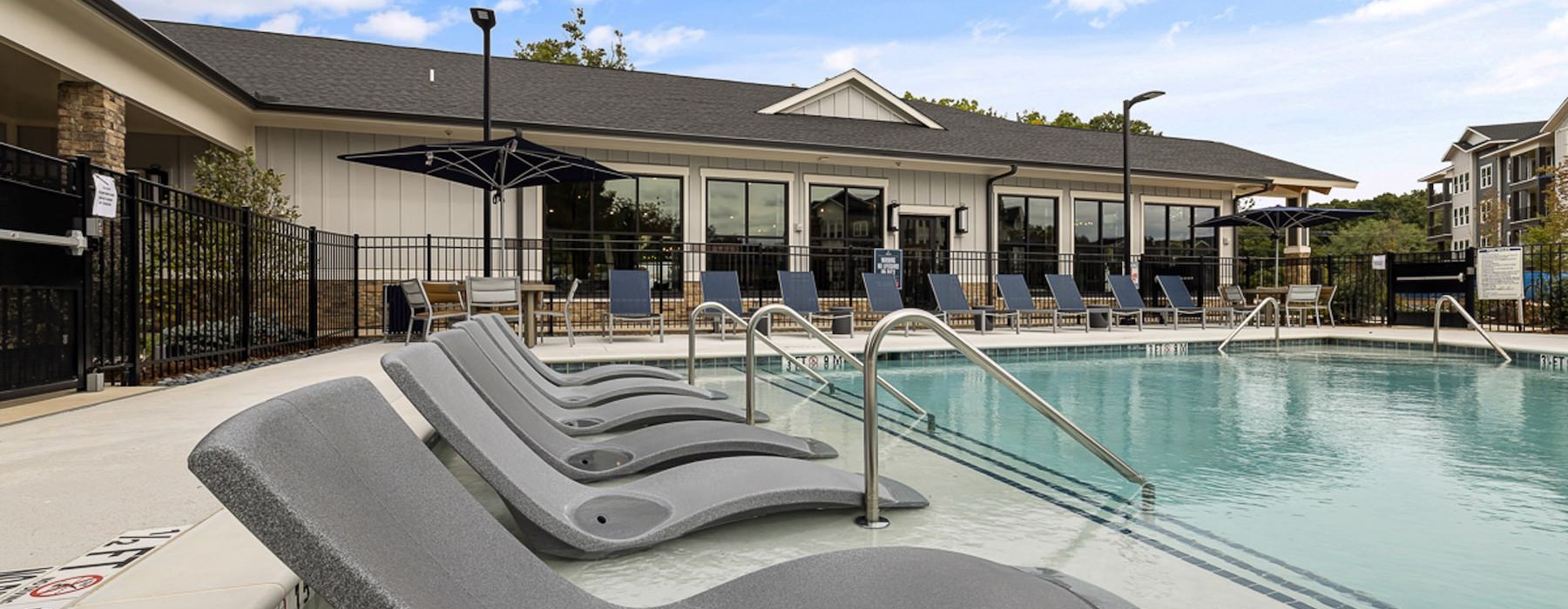 a pool with a building in the background