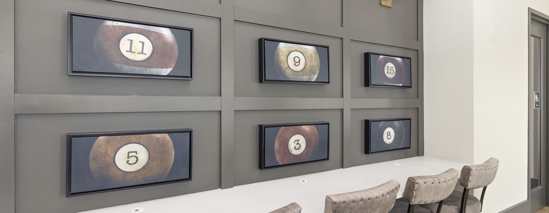 a table with chairs and a table with a light above it