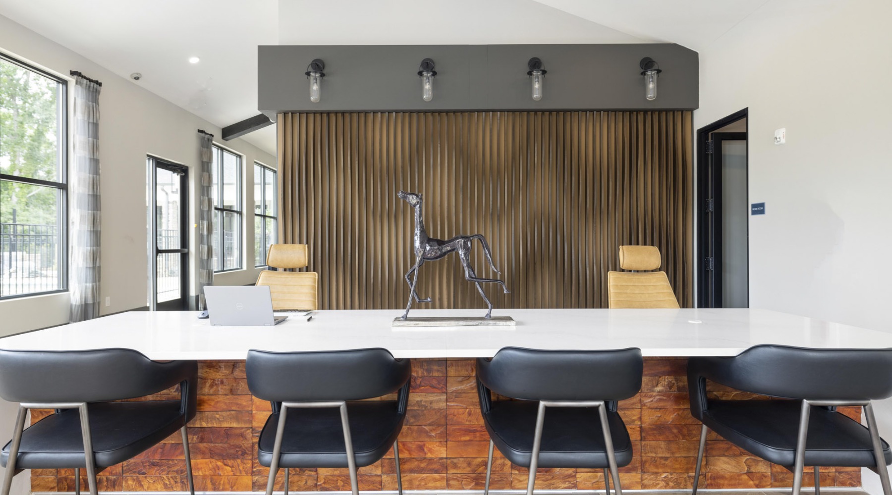 a community kitchen with a table and chairs