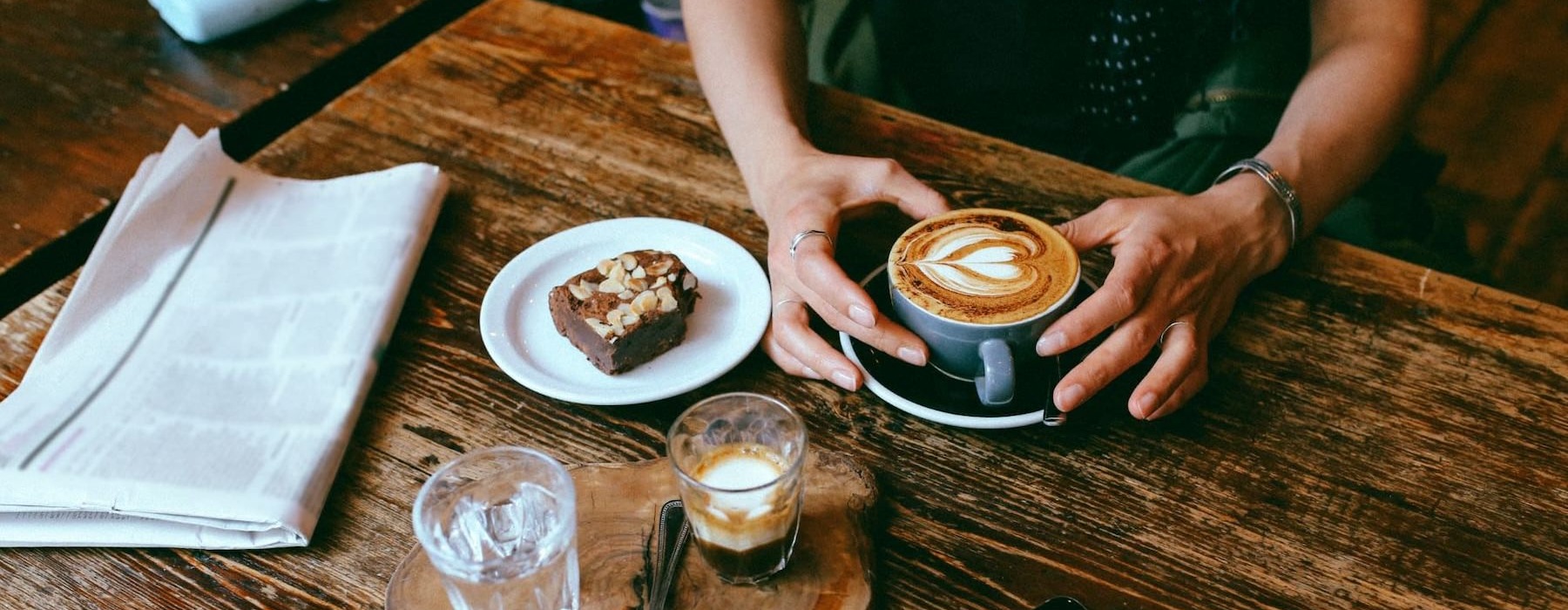a person holding a cup of coffee