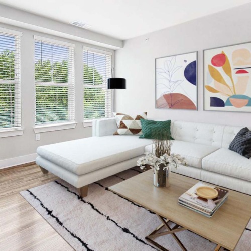 a living room with a white couch and a coffee table