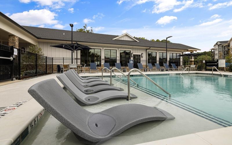 a pool with a building in the background