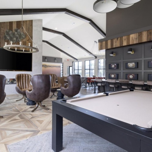 a room with a table and chairs