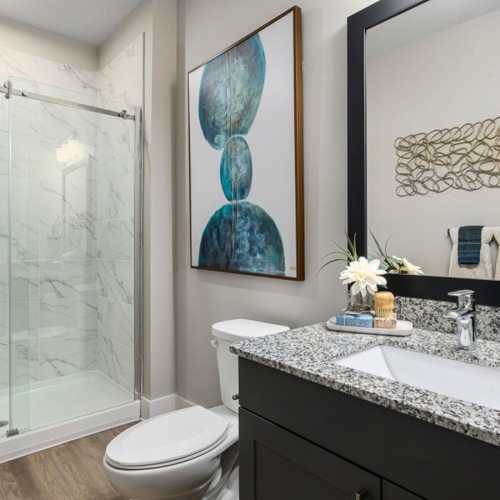 a bathroom with a tub sink and toilet